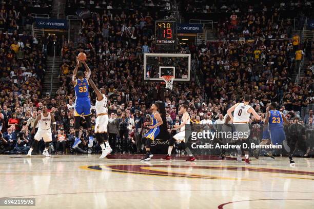 Kevin Durant of the Golden State Warriors shoots the go ahead three pointer in the fourth quarter against LeBron James of the Cleveland Cavaliers in...