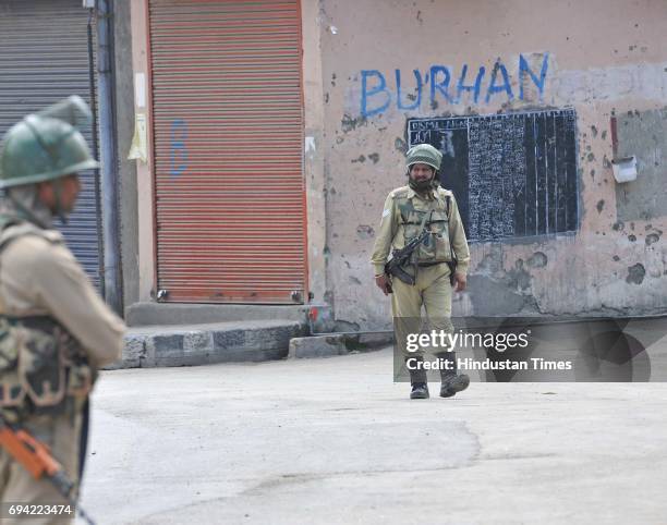 Paramilitary soldiers stands guard during a curfew and strike on June 9, 2017 in downtown Srinagar, India. The valley's separatist leaders had called...