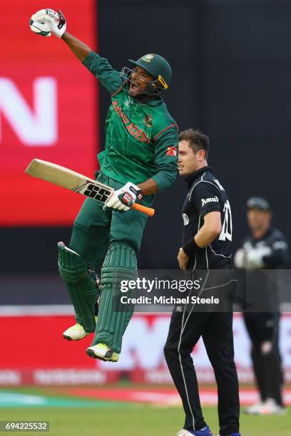 Mahmudullah of Bangladesh celebrates the winning runs as he finishes 102 not out to see his side win by 5 wickets as Adam Milne of New Zealand looks...