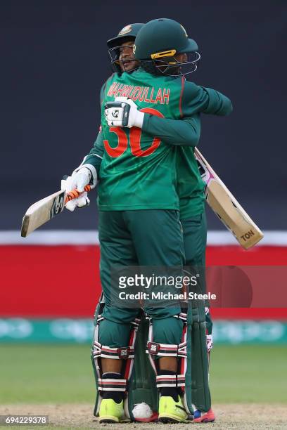 Shakib Al Hasan of Bangladesh celbrates with Mahmudullah after reaching his century during the ICC Champions Trophy match between New Zealand and...