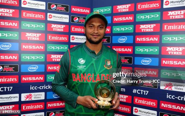 Shakib Al Hasan of Bangladesh poses with the man of the match award during the ICC Champions Trophy match between New Zealand and Bangladesh at the...