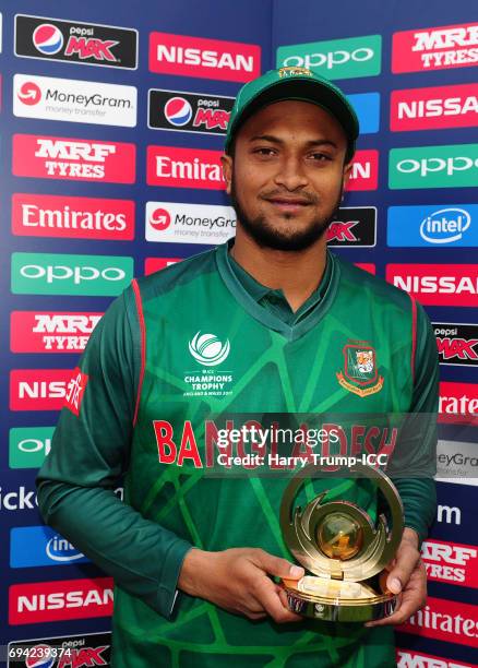 Shakib Al Hasan of Bangladesh poses with the man of the match award during the ICC Champions Trophy match between New Zealand and Bangladesh at the...