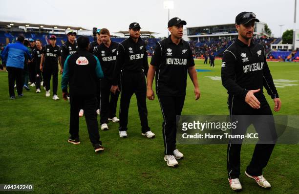 The New Zealand side cut dejected figures during the ICC Champions Trophy match between New Zealand and Bangladesh at the SWALEC Stadium on June 9,...