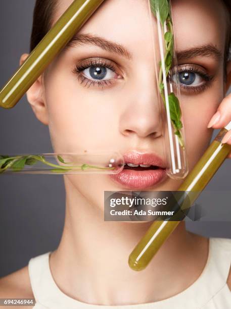 close-up shot of a beautiful woman - green leaf studio shot stock pictures, royalty-free photos & images