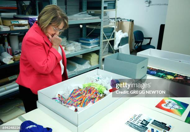 Teresa Jacobs, Mayor of Orange County, Florida, looks over artifacts left as memorials in the wake of the Pulse nightclub shootings, at the History...