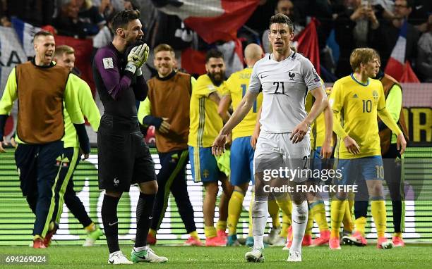France's goalkeeper Hugo Lloris and France's defender Laurent Koscielny react at the end of the FIFA World Cup 2018 qualification football match...