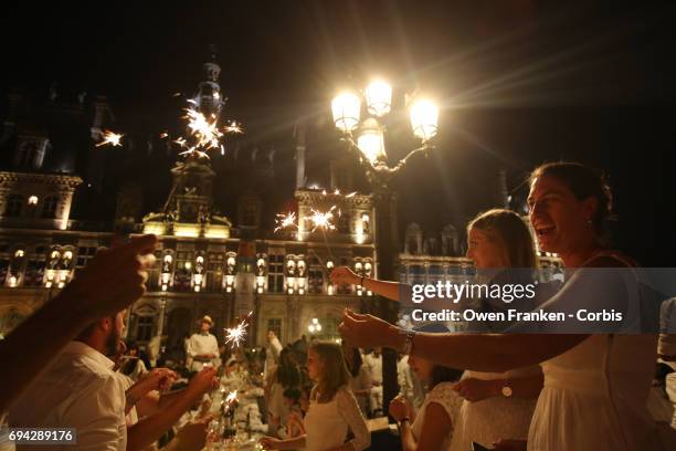 Guests attend the 29th Annual Diner En Blanc at the Paris City Hall Square on June 8, 2017 in Paris, France. The Diner En Blanc is a worldwide event...