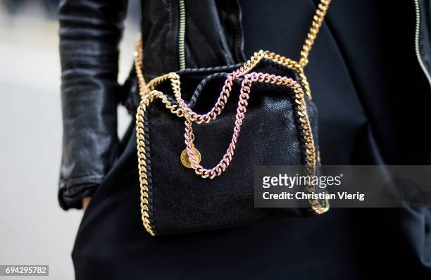 Guest wearing Stella McCartney bag during the London Fashion Week Men's June 2017 collections on June 9, 2017 in London, England.