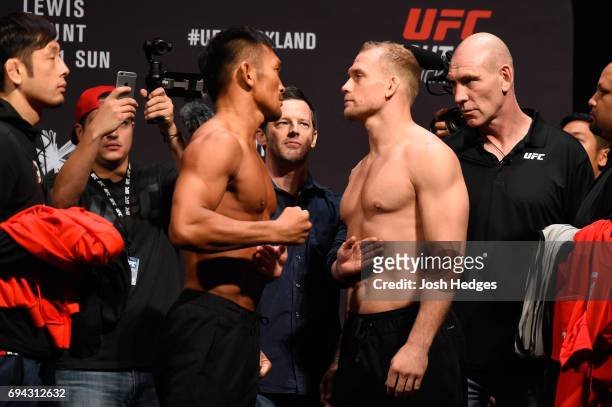 Kiichi Kunimoto of Japan and Zak Ottow of the United States face off during the UFC Fight Night weigh-in at Spark Arena on June 10, 2017 in Auckland,...