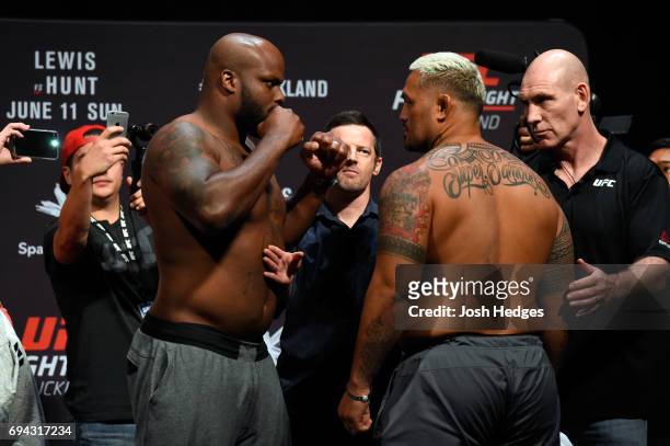 Derrick Lewis of the United States and Mark Hunt of New Zealand face off during the UFC Fight Night weigh-in at Spark Arena on June 10, 2017 in...