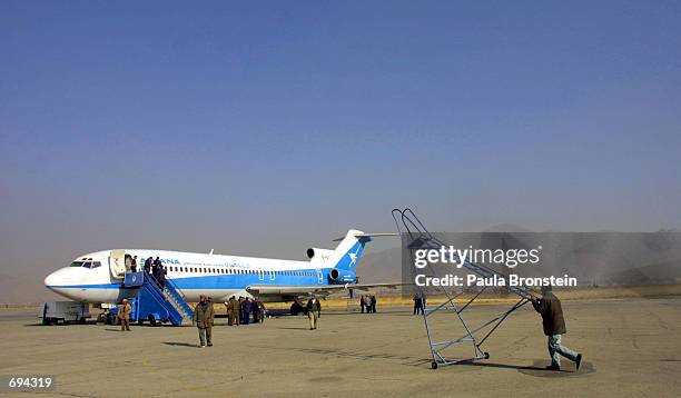 An Ariana Afghan Airlines plane is readied for the airlines'' first international flight in five years January 24, 2002 at Kabul Airport in Kabul,...