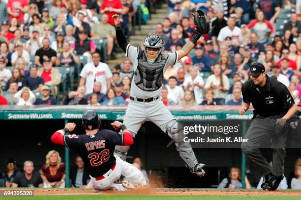 Jason Kipnis of the Cleveland Indians scores on a RBI single in the first inning against Omar Narvaez of the Chicago White Sox at Progressive Field...