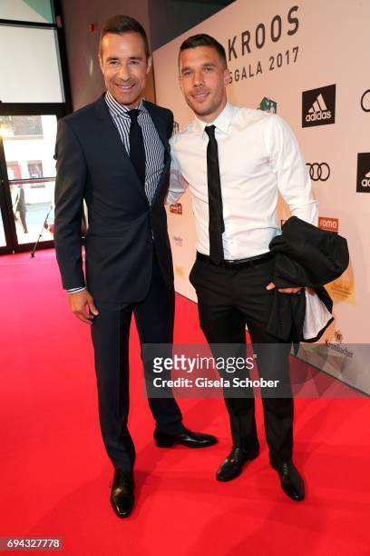 Kai Pflaume and Lukas Podolski during the Toni Kroos charity gala benefit to the Toni Kroos Foundation at 'The Palladium' on June 9, 2017 in Cologne,...
