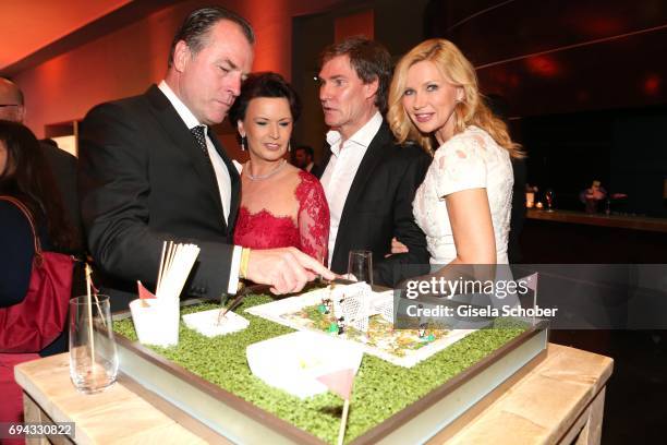 Clemens Toennies, manager of Schalke 04, and his wife Margit Toennies, Carsten Maschmeyer and his wife Veronica Ferres during the Toni Kroos charity...