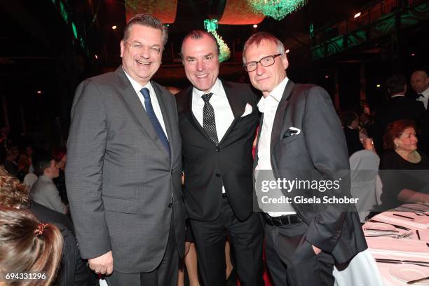 President, Reinhard Grindel , Clemens Toennies, manager of Schalke 04 and Michael Reschke, FC Bayern Muenchen during the Toni Kroos charity gala...