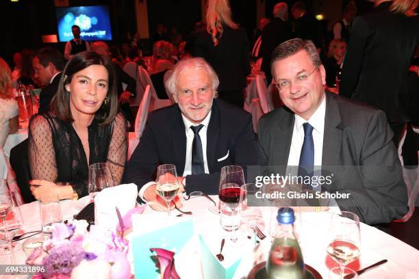 Rudi Voeller and his wife Sabrina Voeller, DFB President Reinhard Grindel during the Toni Kroos charity gala benefit to the Toni Kroos Foundation at...