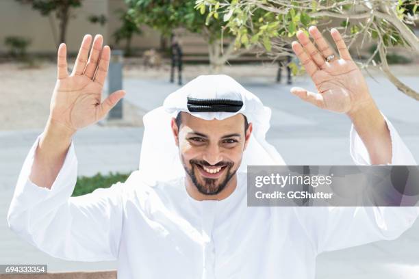 arab raising his hands to gesture welcome - gesturing stock pictures, royalty-free photos & images