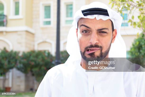 arab showing a strange facial experession - international day one stock pictures, royalty-free photos & images