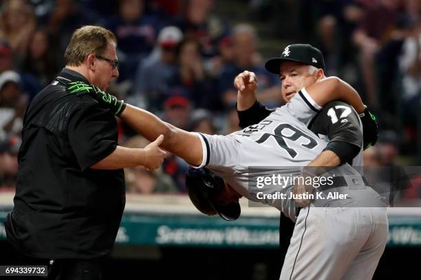 Jose Abreu of the Chicago White Sox is tended to by medical staff after being hit by a pitch in the seventh inning against the Cleveland Indians at...