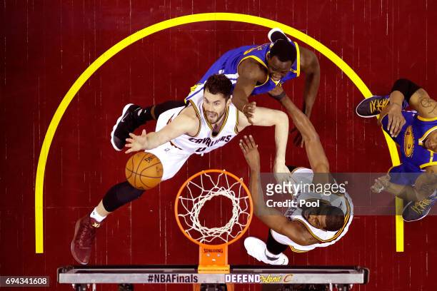 Kevin Love of the Cleveland Cavaliers competes for the ball against Andre Iguodala of the Golden State Warriors in the second quarter in Game 4 of...