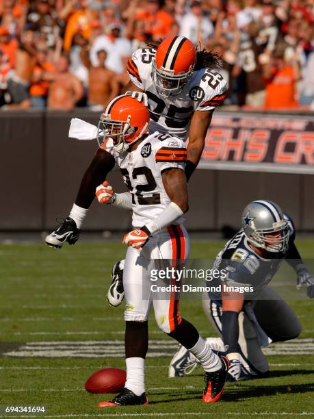 Cornerbacks Terry Cousin and Brandon McDonald of the Cleveland Browns celebrate a third down incomplete pass intended for tight end Jason Witten of...