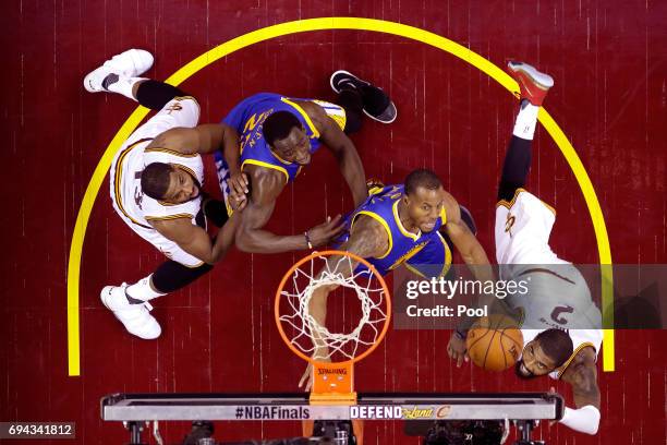 Kyrie Irving of the Cleveland Cavaliers drives to the basket in the second quarter against Andre Iguodala of the Golden State Warriors in Game 4 of...