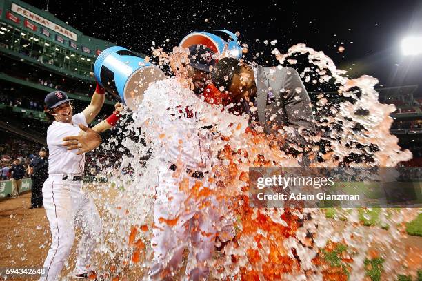 Jackie Bradley Jr. #19 of the Boston Red Sox is showered in Powerade while being interviewed by NESN sideline reporter Jahmai Webster after the...