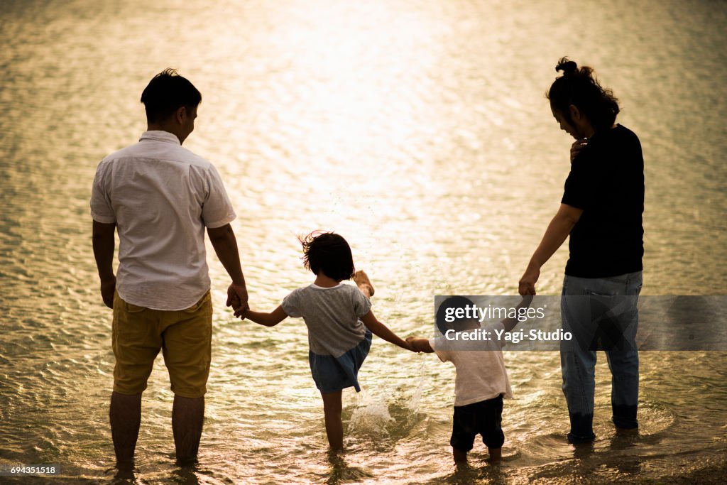 Happy family having a good time in beach.