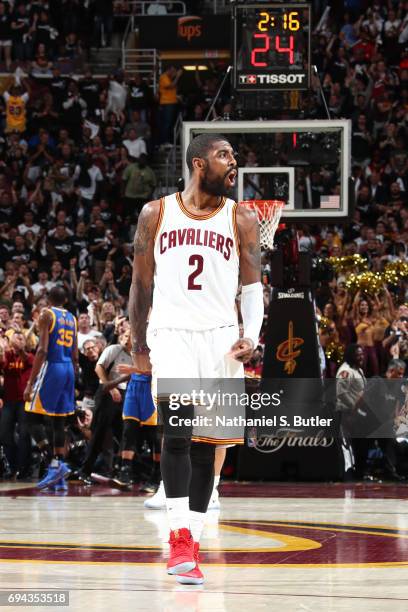 Kyrie Irving of the Cleveland Cavaliers celebrates a three point basket against the Golden State Warriors in Game Four of the 2017 NBA Finals on June...