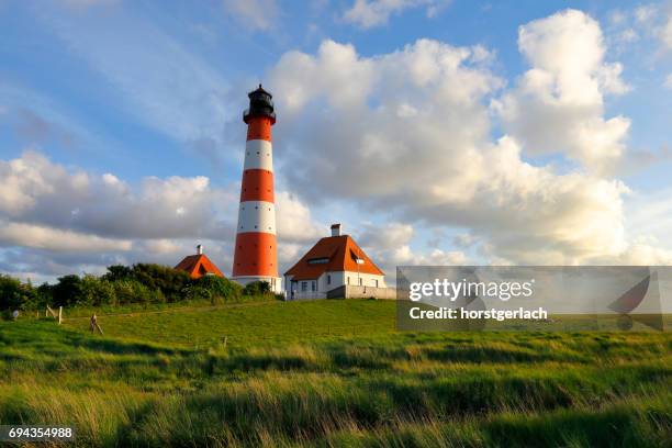 lighthouse of westerhever, germany - schleswig holstein stock pictures, royalty-free photos & images