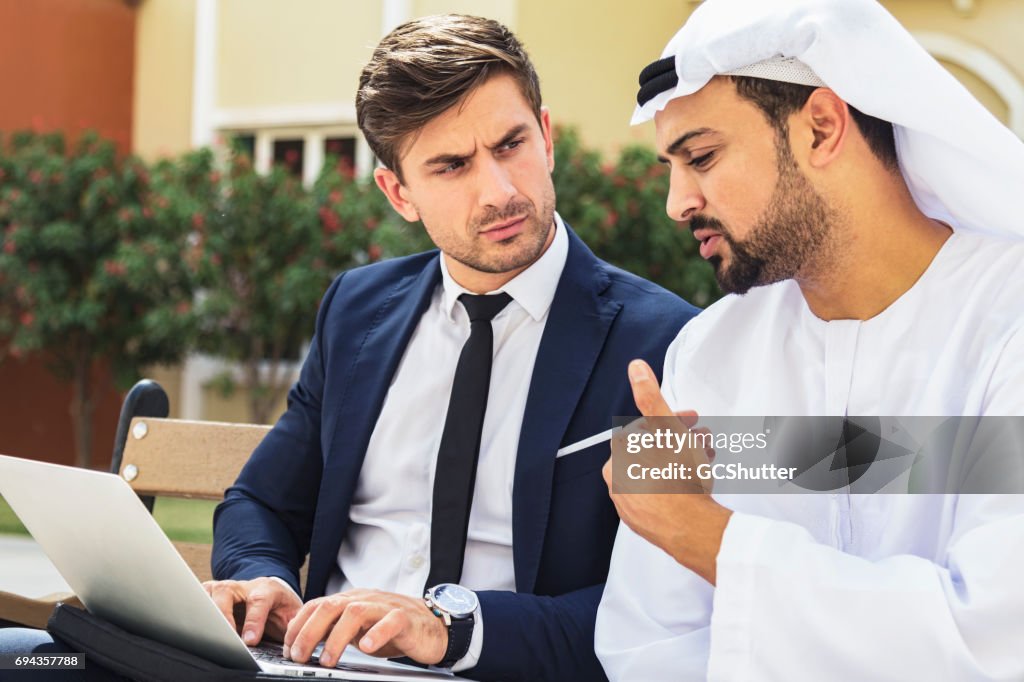 Business executive having a conversation with an Arabian businessman