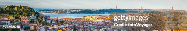 lisbon sunrise panoramic view across city landmarks to bridge portugal - baixa quarter stock pictures, royalty-free photos & images