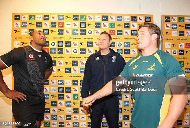 Wallabies captain Michael Hooper and Fiji captain Akapusi Qera toss the coin during the International Test match between the Australian Wallabies and...