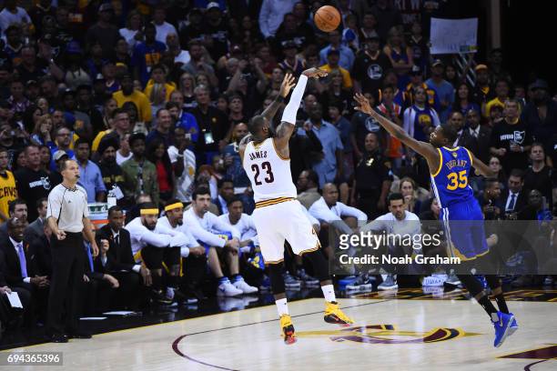 LeBron James of the Cleveland Cavaliers shoots the ball against Kevin Durant of the Golden State Warriors in Game Four of the 2017 NBA Finals on June...