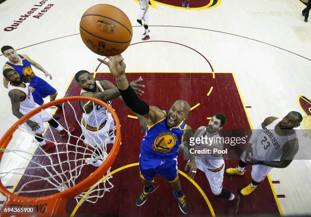 David West of the Golden State Warriors shoots in the second half against Tristan Thompson and Kevin Love of the Cleveland Cavaliers in Game 4 of the...