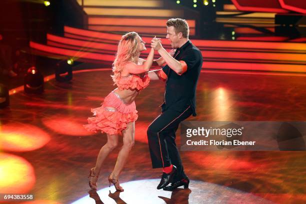 Bastiaan Ragas and Sarah Latton perform on stage during the final show of the tenth season of the television competition 'Let's Dance' on June 9,...