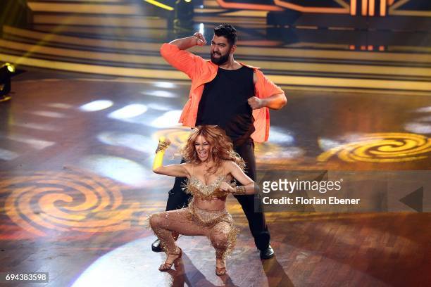 Faisal Kawusi and Oana Nechiti perform on stage during the final show of the tenth season of the television competition 'Let's Dance' on June 9, 2017...