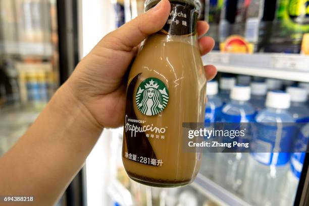 Customer buys a Starbucks bottled Frappuccino in a Convenience Store. In the first quarter of 2017, targeting to the Chinese consumers, Starbucks...