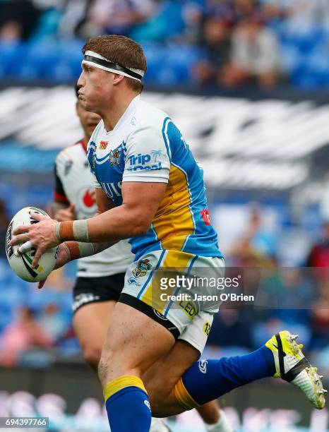 Jarrod Wallace of the Titans runs the ball during the round 14 NRL match between the Gold Coast Titans and the New Zealand Warriors at Cbus Super...
