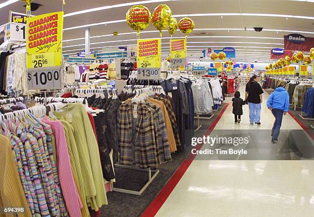 Shoppers browse inside a Wal-Mart store January 24, 2002 in Mount Prospect, IL. Wal-Mart Stores Inc. Is ready to jump to the top of the Fortune 500...