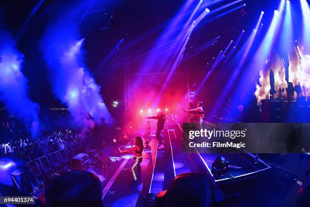 Recording artist Walshy Fire of Major Lazer performs with dancers onstage at What Stage during Day 2 of the 2017 Bonnaroo Arts And Music Festival on...