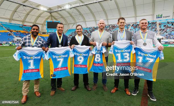 Former titan players who were named in the team of the decade pose for a photograph during the round 14 NRL match between the Gold Coast Titans and...