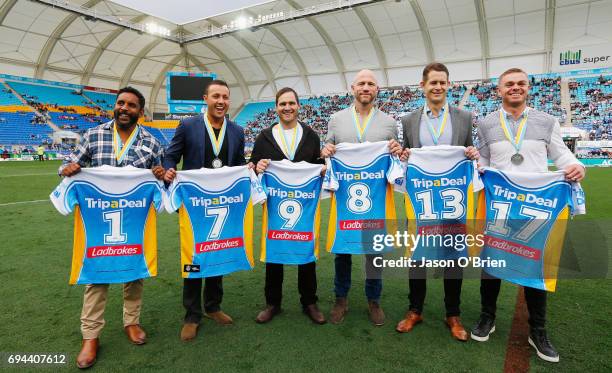 Former titan players who were named in the team of the decade pose for a photograph during the round 14 NRL match between the Gold Coast Titans and...