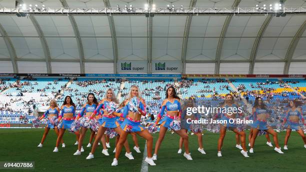 Titans cheerleaders perform during the round 14 NRL match between the Gold Coast Titans and the New Zealand Warriors at Cbus Super Stadium on June...