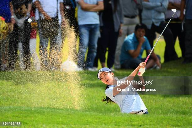 Kotone Hori of Japan chips onto the 17th green during the third round of the Suntory Ladies Open at the Rokko Kokusai Golf Club on June 10, 2017 in...