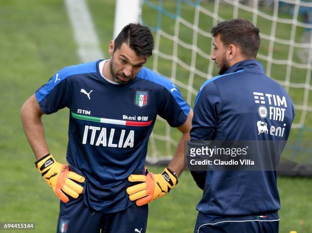 Gianluigi Buffon and Gianluigi Donnarumma of Italy chat during the training session at Coverciano on June 10, 2017 in Florence, Italy.