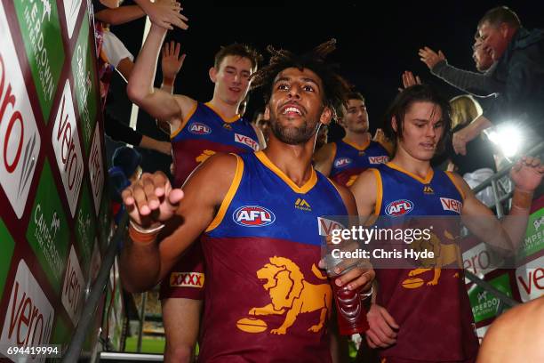 Archie Smith of the Lions celebrates winning the round 12 AFL match between the Brisbane Lions and the Fremantle Dockers at The Gabba on June 10,...