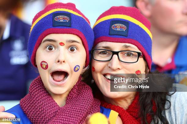 Lions fans cheer during the round 12 AFL match between the Brisbane Lions and the Fremantle Dockers at The Gabba on June 10, 2017 in Brisbane,...