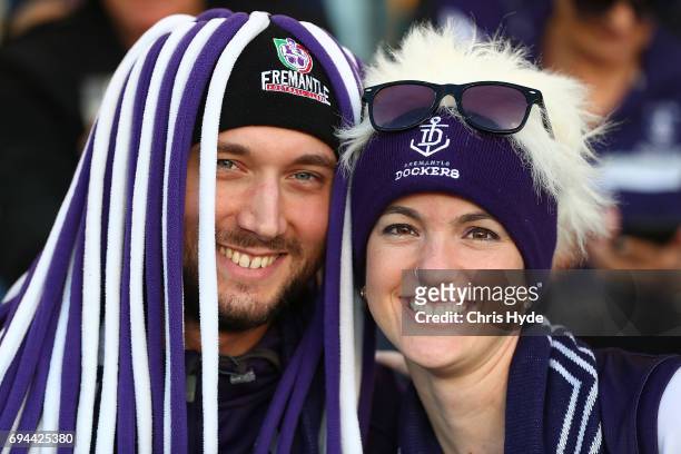 Dockers fans cheer during the round 12 AFL match between the Brisbane Lions and the Fremantle Dockers at The Gabba on June 10, 2017 in Brisbane,...