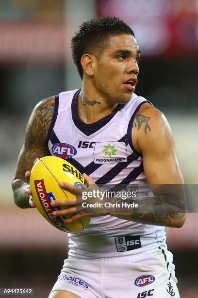 Michael Walters of the Dockes runs the ball during the round 12 AFL match between the Brisbane Lions and the Fremantle Dockers at The Gabba on June...